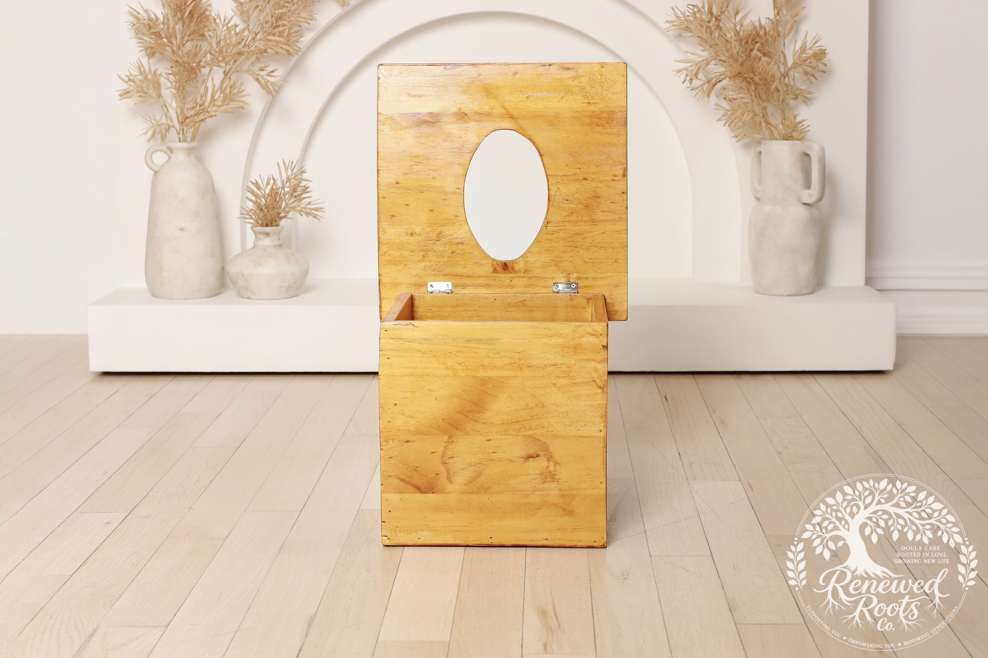 Open wooden yoni steaming seat in a calm wellness setting